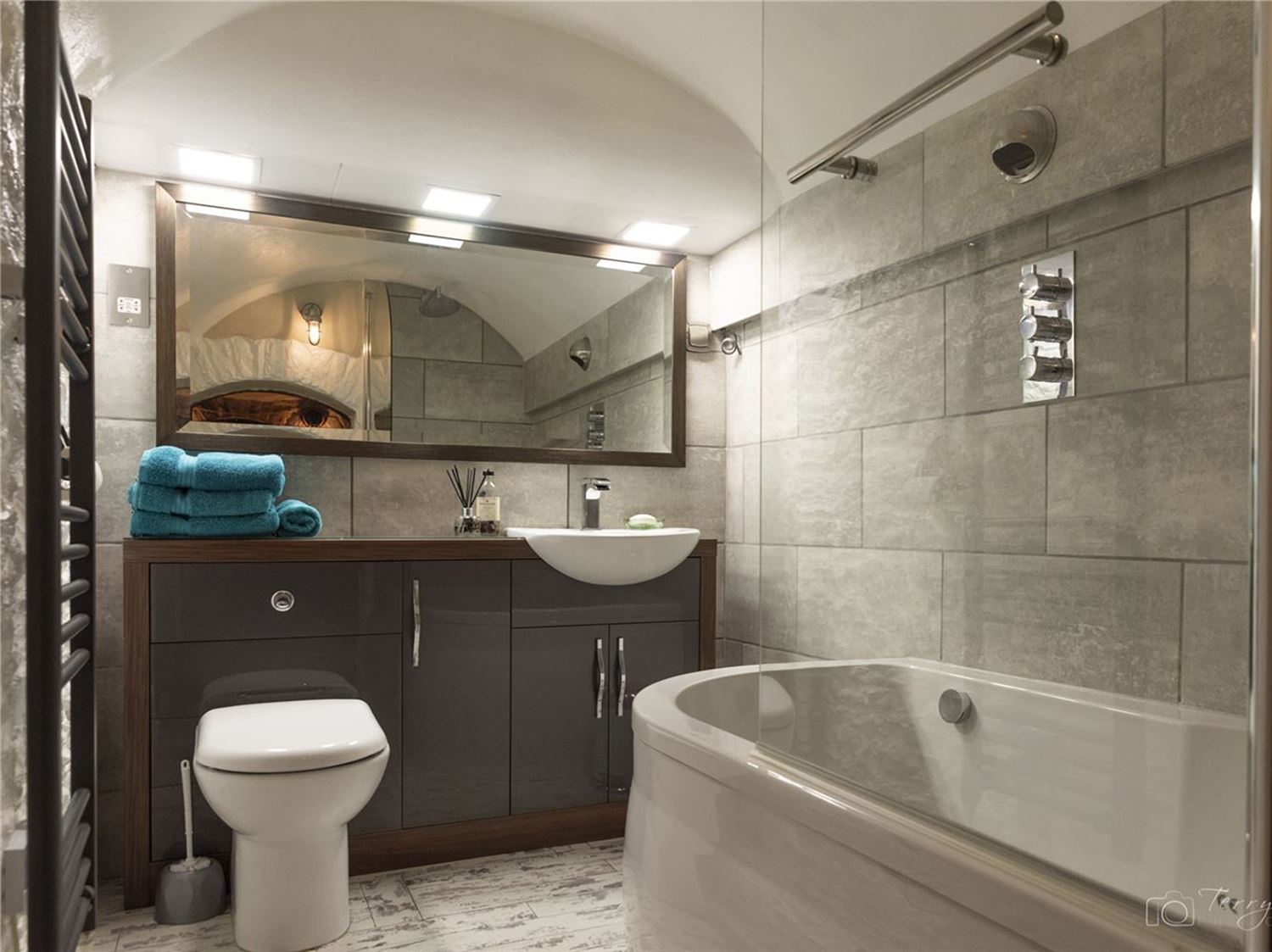 En-Suite from the Master Bedroom with large quadrant shower with rain drenching shower head, , dual sinks and a toilet