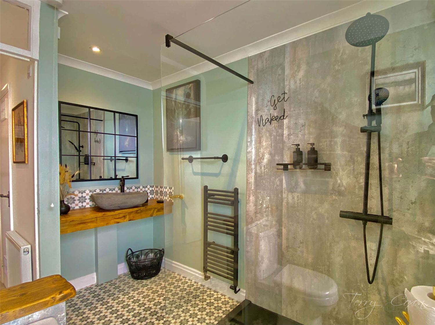 Rock Cottage Shower room with Double Walk in Shower, looking towards the hollwed out rock sink with black mono top