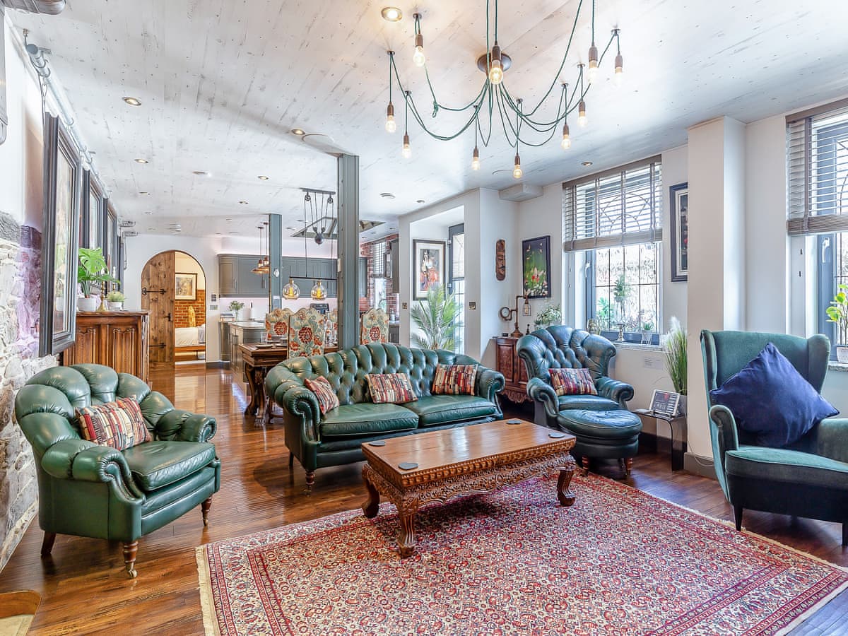 View towards the kitchen island over the green sofa back