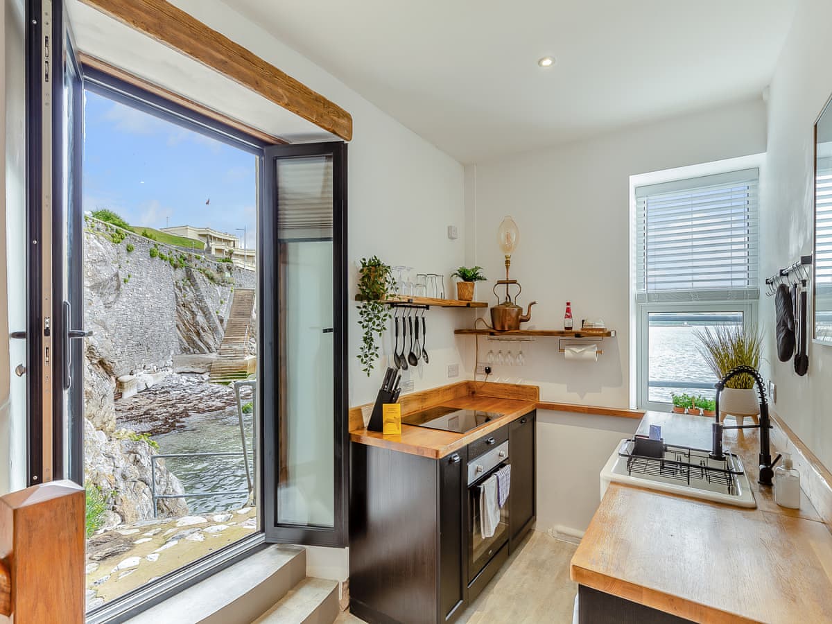 Rock Cottage Kitchen Towards the window and back door across the kitchen