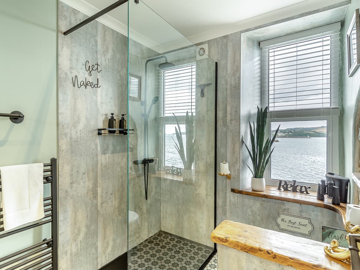 Large walk in shower with WC facing the window for the "best seat in the house"